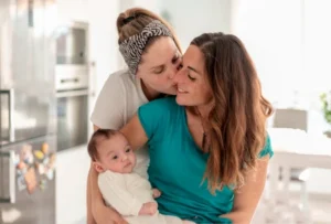Stepparent adoption. A young lesbian couple with their baby